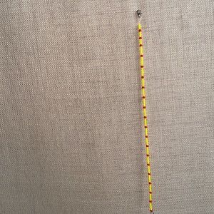 A choker necklace, with yellow and red beads